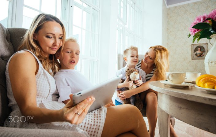 Moms and kids spending time in the living room